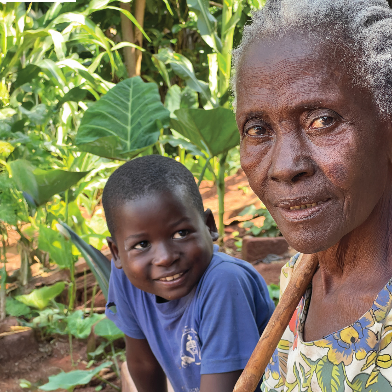 Margaret is pictured here looking at the camera, whilst her grandson looks adoringly at her