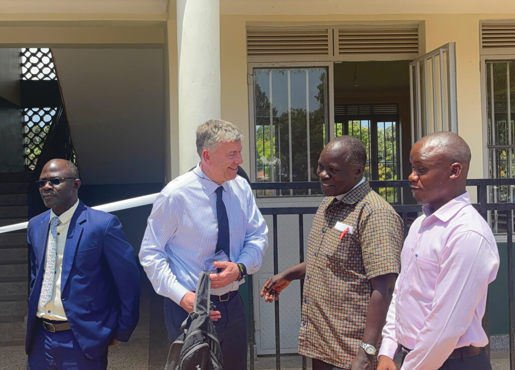 Three leaders from Uganda and one from the UK chatting