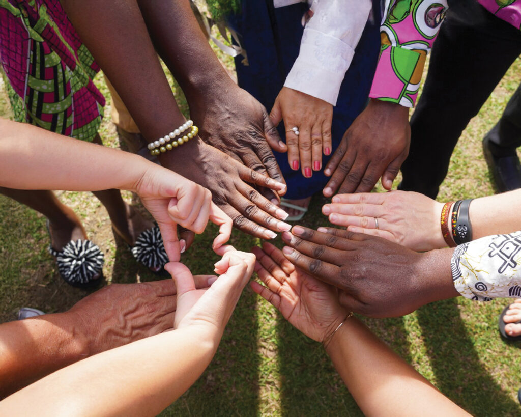A diverse circle of hands together