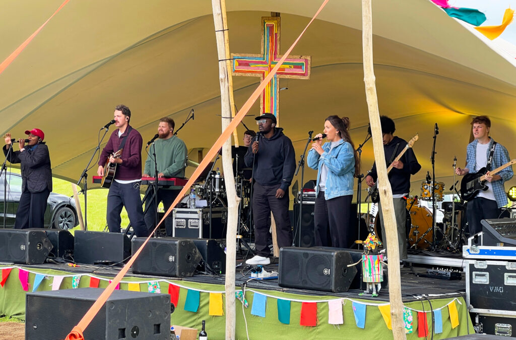 A close-up of the Christian band singing on stage