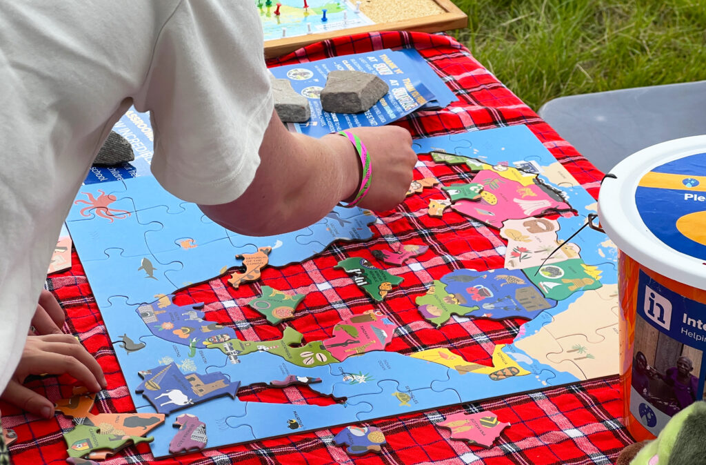 Puzzles and prayer boards on our International Needs stand